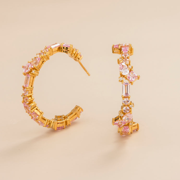 Lanna large hoop earrings in 18K gold vermeil set with lab grown diamond and pink sapphire gem stones.
