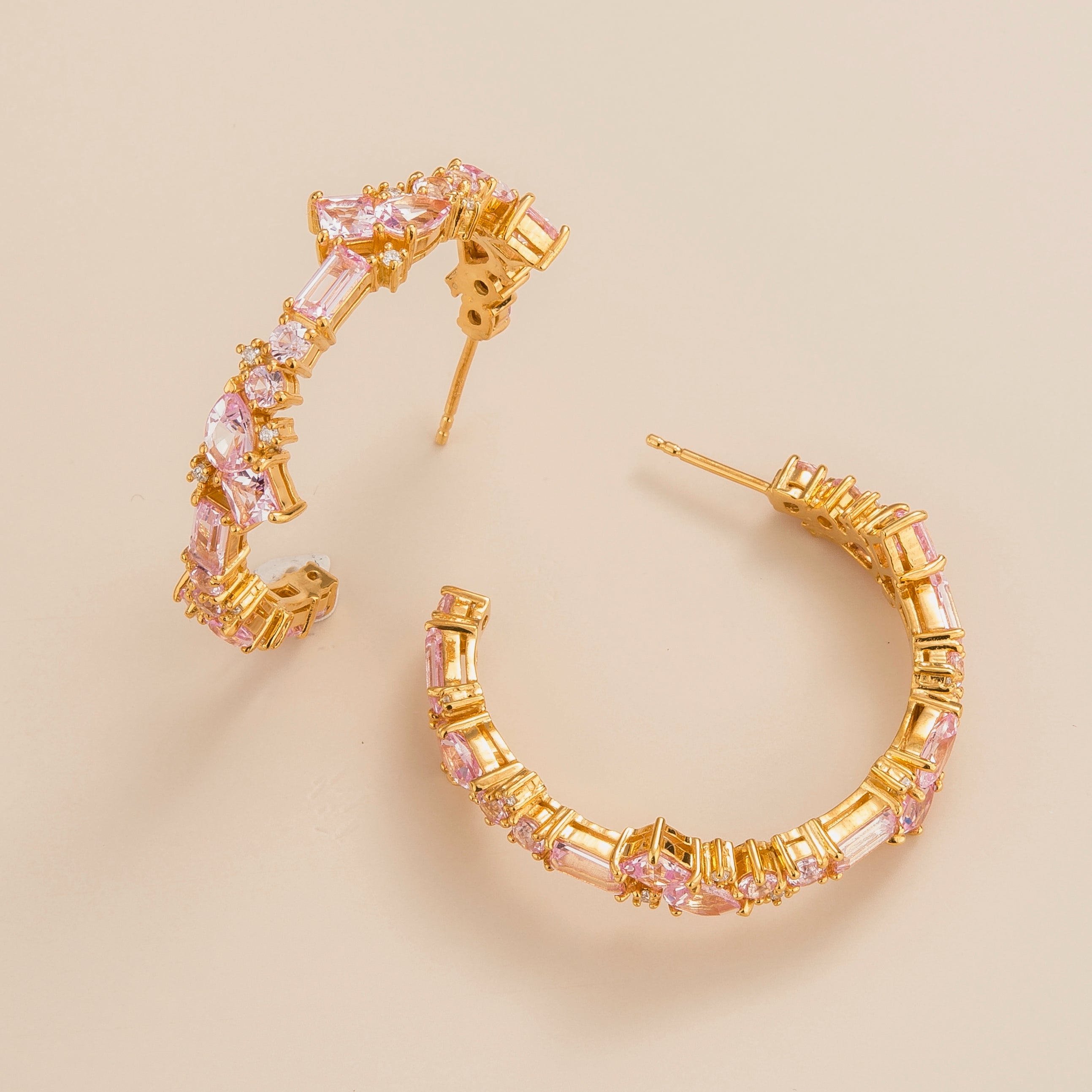 Lanna large hoop earrings in 18K gold vermeil set with lab grown diamond and pink sapphire gem stones.