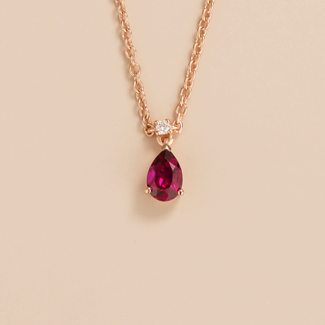 Ori pear drop necklace in 18K pink gold vermeil set with lab grown ruby and diamond gem stones.
