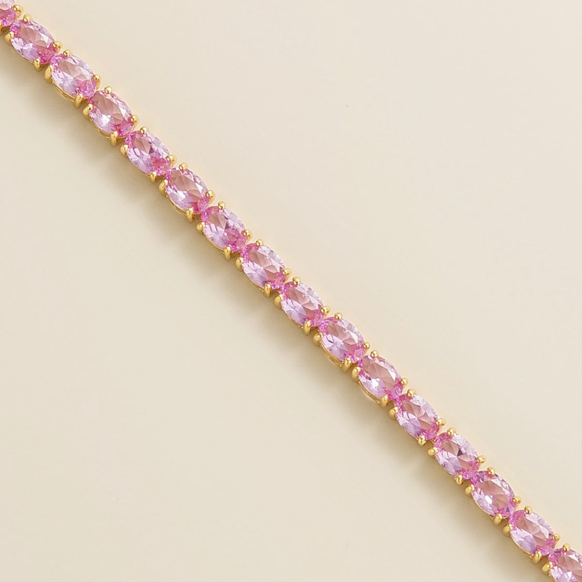 Salto Pastel Pink Sapphire Oval Tennis Bracelet in Gold – angle view