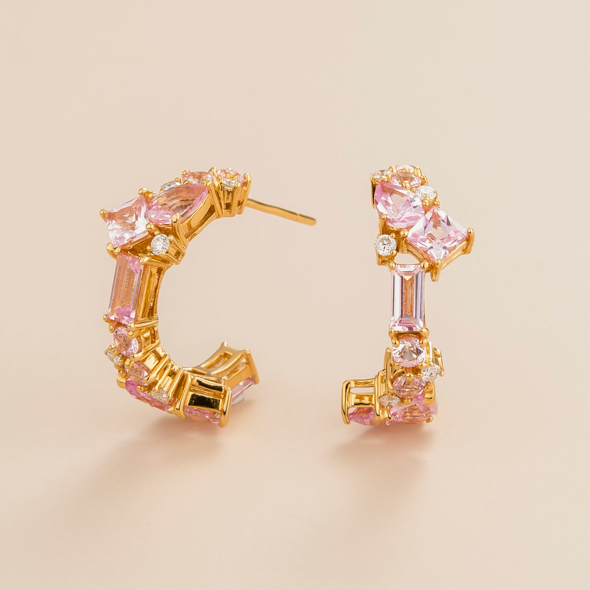 Lanna medium hoop earrings in 18k gold vermeil set with lab grown pink sapphire and diamond gem stones. Perfect for yourself and as gift.