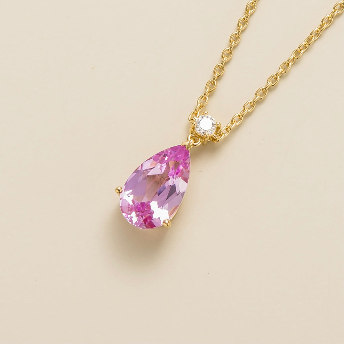 Lab-grown pink sapphire and diamond pear drop pendant necklace in gold, large – angled view | Pisa by Juvetti
